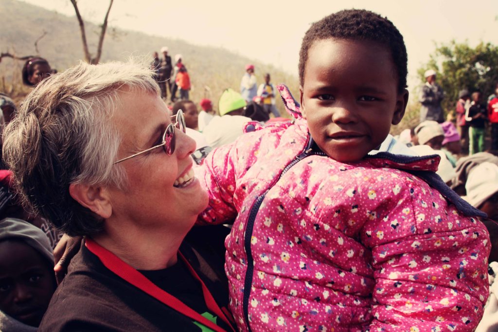 Volunteer and Child in Eswatini, Africa on Mission Trip