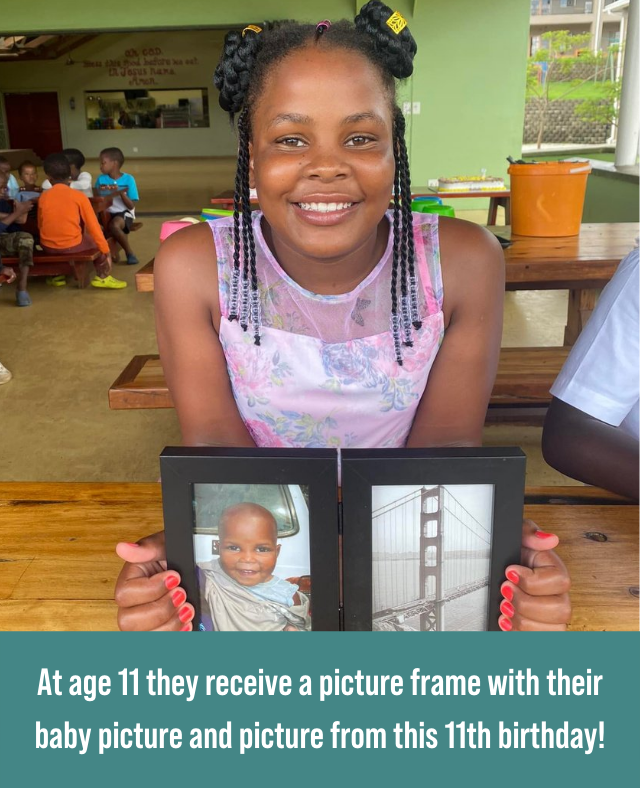 Picture of child with a picture frame for birthday.