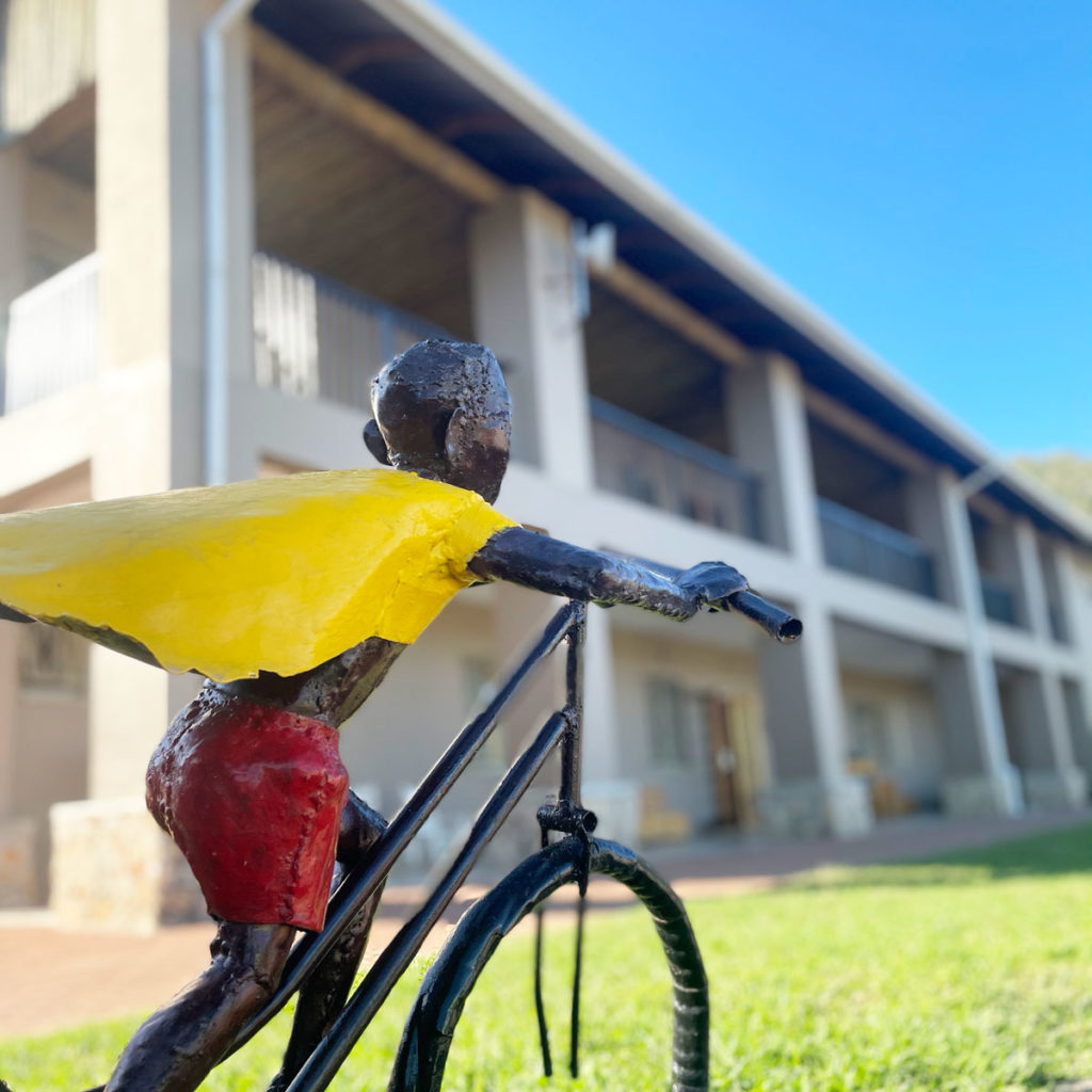 A statue of a child riding a bike at Project Canaan.